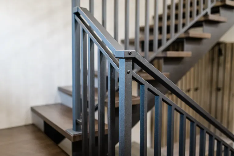 Custom stair millwork and metal railing in an AXIS home