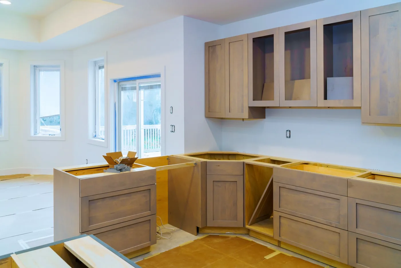 Kitchen remodel in progress with new cabinets installed