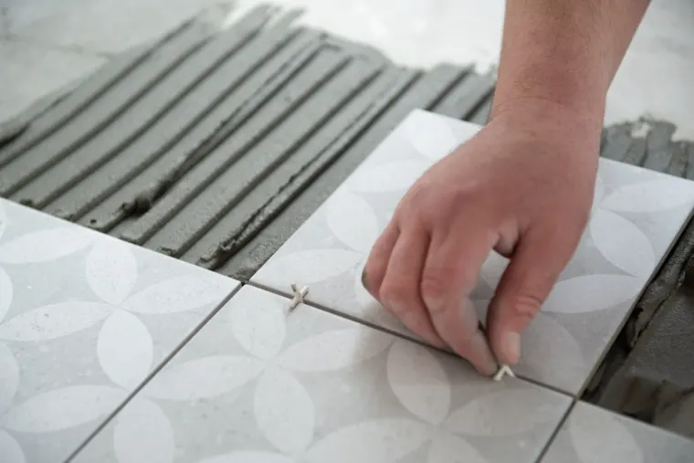 Tile being set during a bathroom renovation in Southwest Indiana